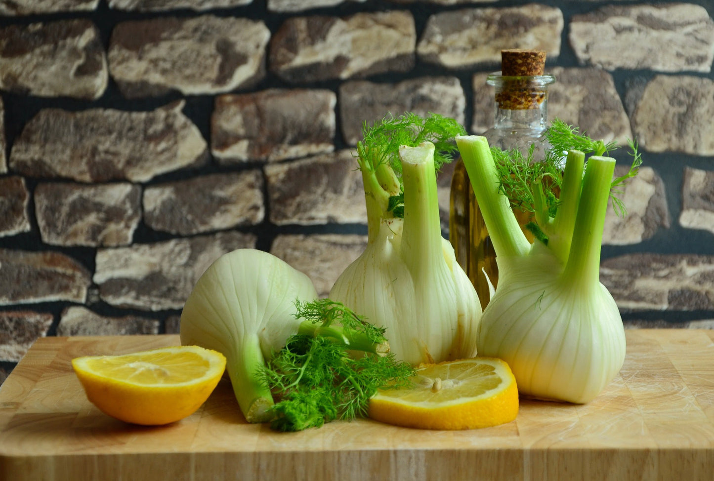 Fresh Florence fennel bulbs displayed on a kitchen counter