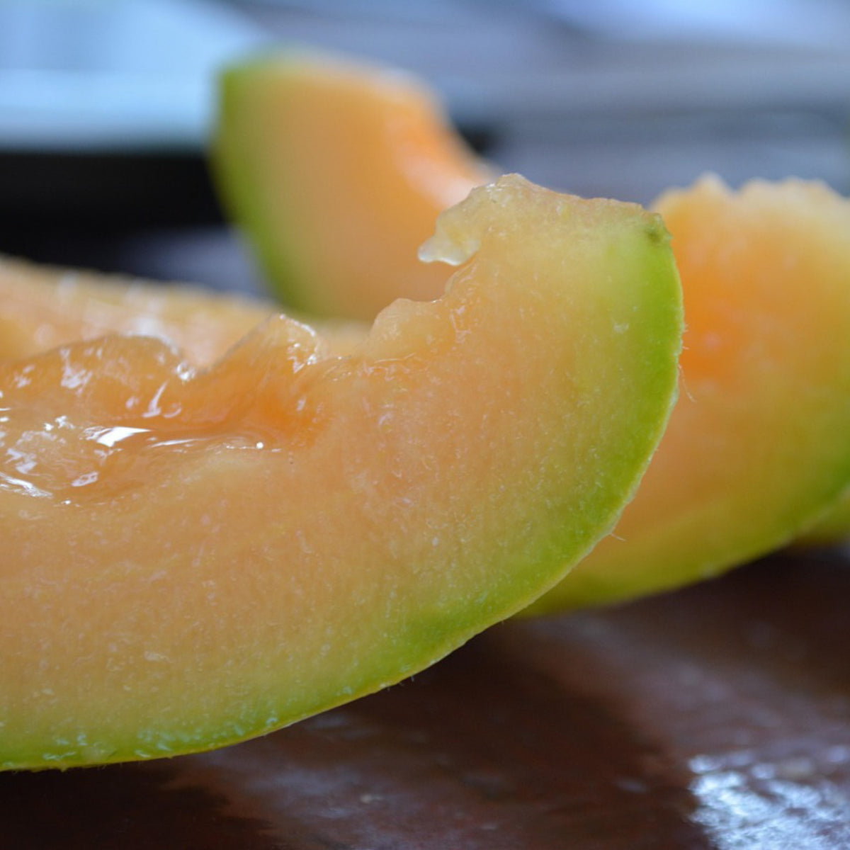 Hales Best Cantaloupe sliced open showing sweet orange flesh