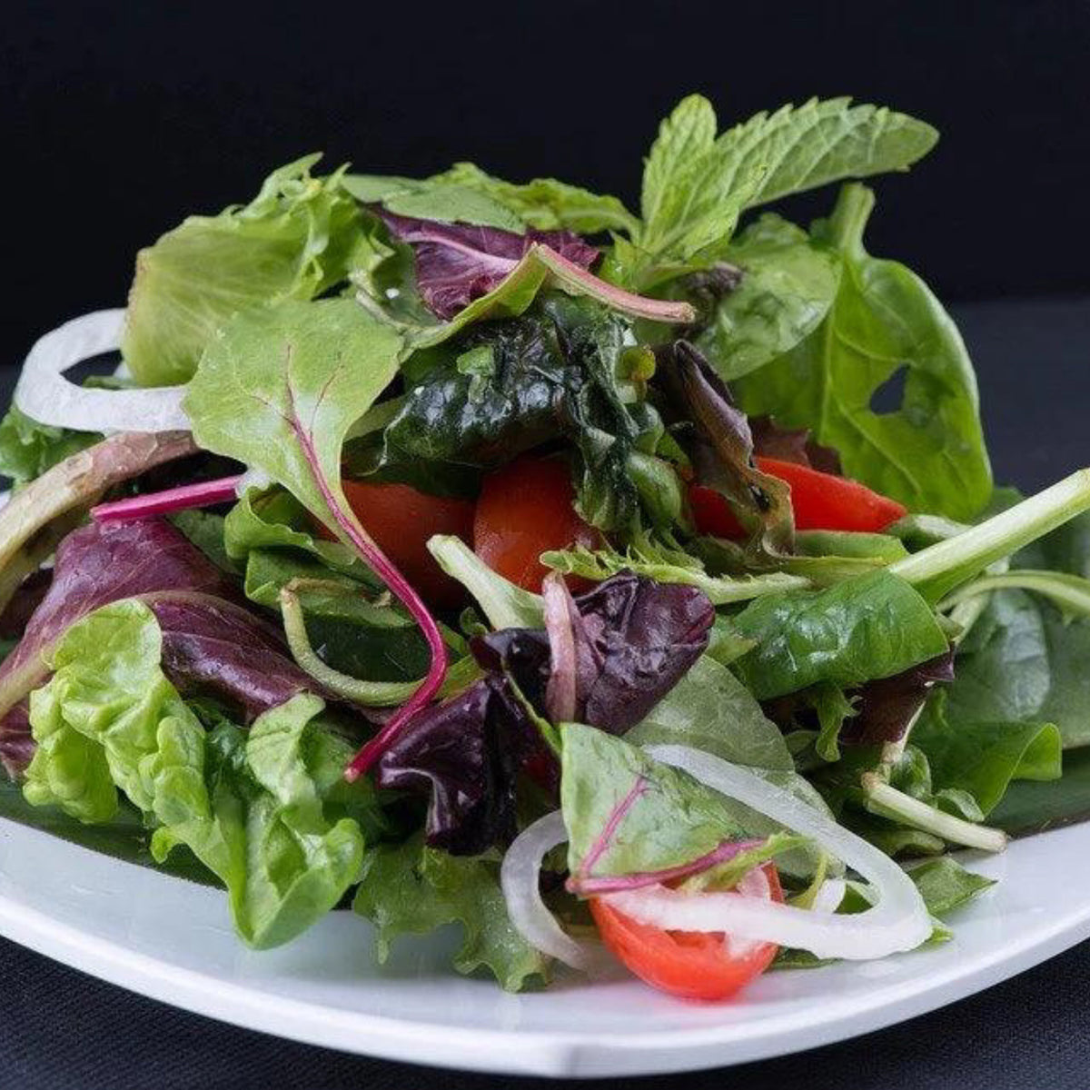 Mesclun Sweet Salad Mix with fresh mixed greens, tomatoes and onion